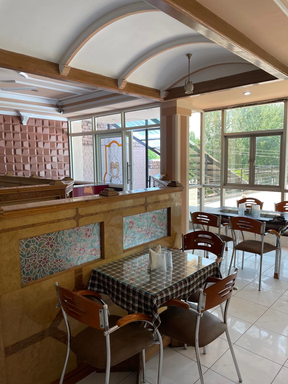 Second view of the dining room at Sunset Boulevard Restaurant - intimate seating arrangements with natural light
